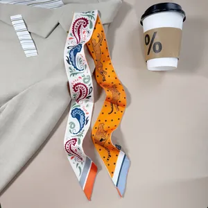 Double-sided twilly scarf featuring paisley patterns and leopard prints on a beige shirt