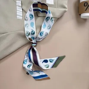 Artistic retro portrait print silk twilly scarf tied in an elegant bow knot on a blazer