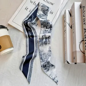 Detail of vintage French style skinny silk scarf featuring Paris motifs and architecture