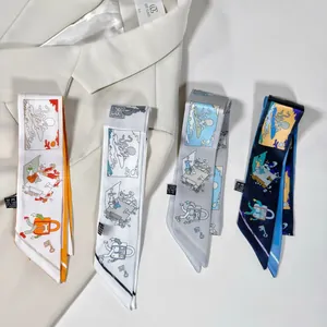 Polyester twilly scarves with vintage prints displayed on a white blazer lapel