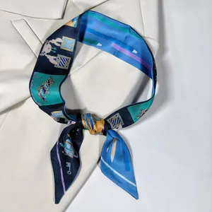 Close-up of a printed satin skinny scarf knotted on a chic beige blazer lapel