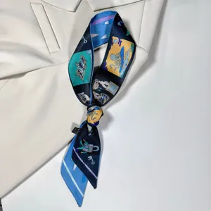 Detail of blue printed twilly silk scarf draped on a white blazer showing cartoon octopus patterns