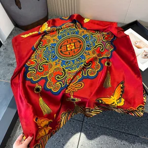 Detail of red silk scarf showing traditional Longevity patterns and butterfly embroidery