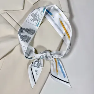 Close-up of narrow silk scarf with whimsical octopus print styled on a beige blazer