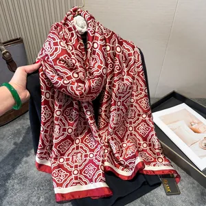 Close-up of red and white silk scarf with traditional Chinese knot and Fu patterns