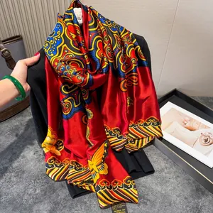 Detail of red silk scarf with traditional patterns on black suit jacket
