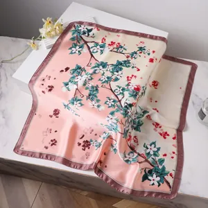 Pink floral square silk scarf with elegant white blossoms and dark hem border