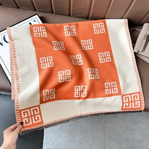Luxurious orange and beige cashmere-style scarf with geometric 4G logo and fringe edges