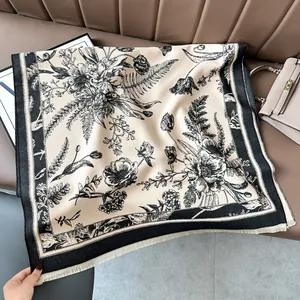 Detail of floral vintage cashmere shawl with elegant fringe on a leather background