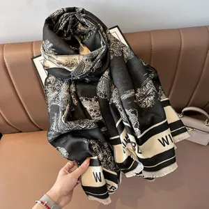 Thick black and white cashmere-like scarf with landscape print and fringe edges