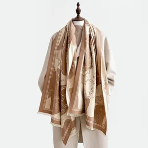 Close-up of camel wool scarf showing artistic horse print and fine fringe details