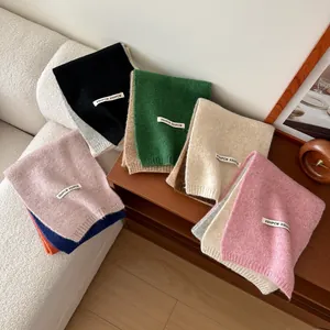 Cozy knit wool scarves in multiple colors including green, beige, and pink for winter warmth