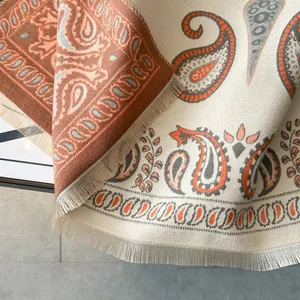 Detail of winter paisley scarf with fringe edges and soft cashmere-like texture