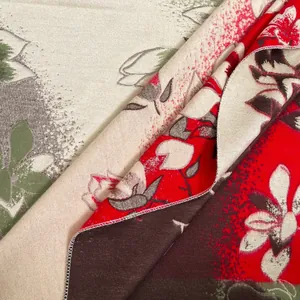 Detailed view of jacquard floral scarf showing rich texture and magnolia flower pattern