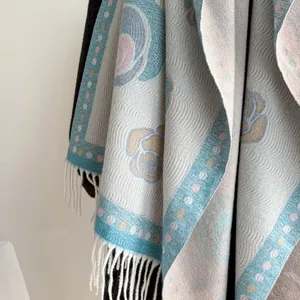 Macro shot of camellia jacquard fabric with soft fringe edge on vintage style shawl