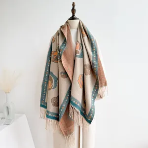Vintage floral cashmere-feel shawl with fringe trim on female mannequin display