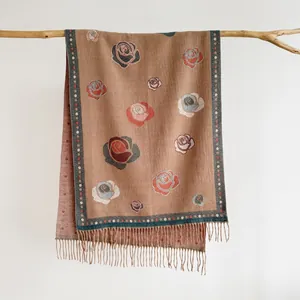 Detail of vintage camellia floral cashmere-like shawl with elegant hanging fringe