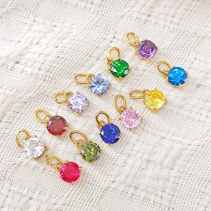 Detail of colorful round birthstone pendants with 18k gold plated stainless steel claws
