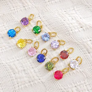 Set of 12 vibrant round birthstone charms with 18k gold plated stainless steel edges