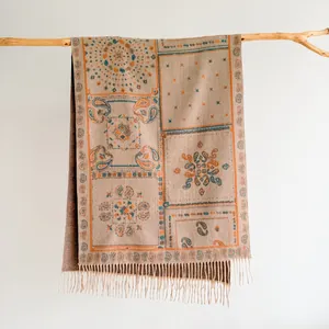 Close-up of Bohemian pashmina scarf with paisley pattern, fringe details and ethnic jacquard