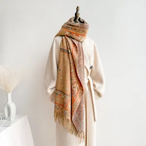 Detail of bohemian paisley shawl showing rich texture and fine tassel fringe craftsmanship