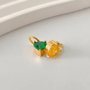 Exquisite gold heart pendant with emerald green and bright yellow zircon stones