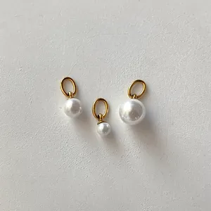Three gradient sizes of white freshwater pearl pendants with gold loops for jewelry DIY