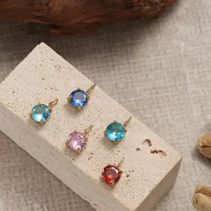 Detail view of five assorted color crystal pendants on 14K gold plated mounts