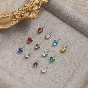 Set of twelve heart-shaped crystal pendants in varied colors with silver metal settings