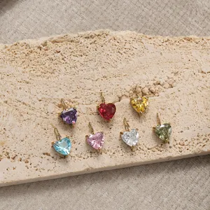 Detailed view of heart-shaped crystal pendants in seven colors with golden metal settings