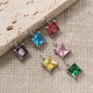 Macro view of square cut gemstones in six colors with silver four-prong settings