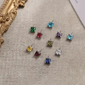 Detail of square colorful crystal charms with stainless steel claw settings for DIY jewelry