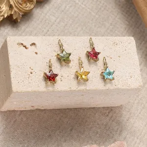 Set of five colorful star-shaped stainless steel charms with gold plated borders