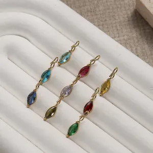 Detailed close-up of colorful marquise-cut zircon charms with gold plating for DIY jewelry