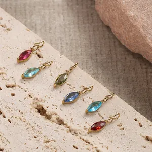 Macro shot of marquise-cut colorful gem pendants on gold-plated stainless steel bases