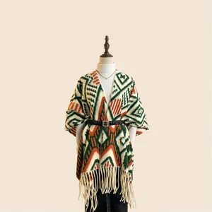 Thick bohemian geometric jacquard shawl cape with fringe trim and oversized fit