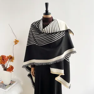 Women's cashmere-like shawl with geometric black and white stripes and gray tassels
