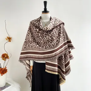 Elegant leopard print poncho shawl for winter with stylish fringed edges and soft texture