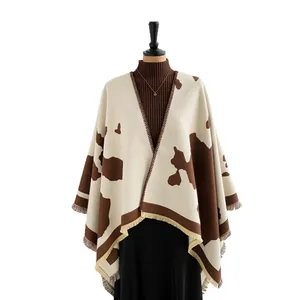 Women's travel shawl with brown milk pattern, knitted texture and tassel hem design