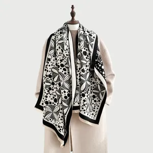 Women's black and white jacquard cashmere-feel scarf with tassels and polka dot pattern