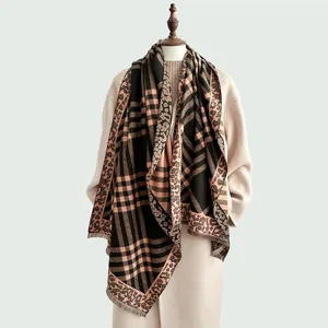 Close-up of Maillard plaid scarf with leopard print accents and fringe detailing