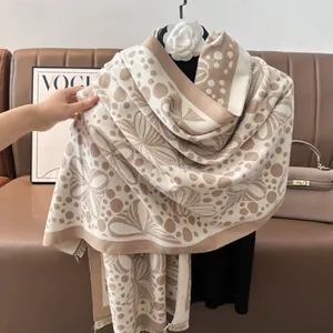 Detailed texture of jacquard cashmere shawl scarf with floral patterns and short tassels