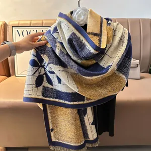 Detailed view of the retro floral patchwork cashmere-like scarf with fringe tassels