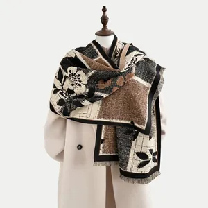 Close-up of vintage floral cashmere-like scarf with fringe details and thick texture