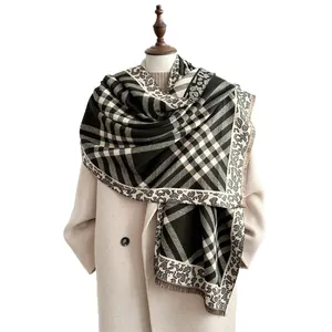 Maillard plaid and leopard print tassel shawl scarf styled on a beige winter coat