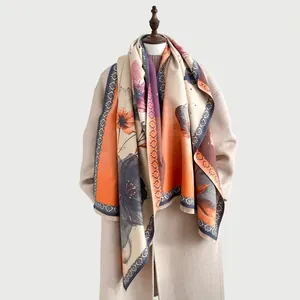 Detail of winter faux cashmere scarf featuring ink lotus art and vintage floral patterns