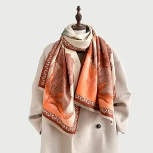 Detail of winter scarf with lotus floral print, fringe edges and soft texture