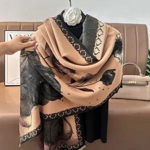 Close-up of winter pashmina shawl featuring lotus ink painting and vintage chain patterns