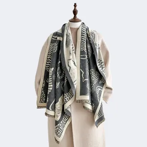 Close-up of cat pattern and zebra stripes on thick cashmere-like scarf with fringe