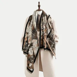 Detailed view of floral pattern and fringe edge on cashmere-feel winter scarf